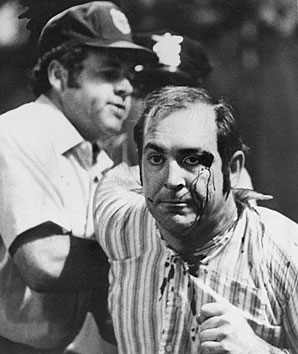 Umpire Joe Brinkman and a bloodied fan were caught up in the mayhem of a promotion gone wrong. (AP)